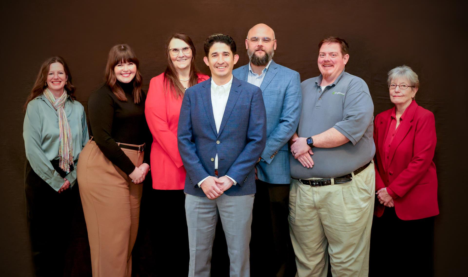 City council members smiling and standing next to each other: Tena Prange, Chelsea Nunnenkamp, Kim Wright, Othoniel Sierra, Joe Anderson, Steve Ward, Rita Russell