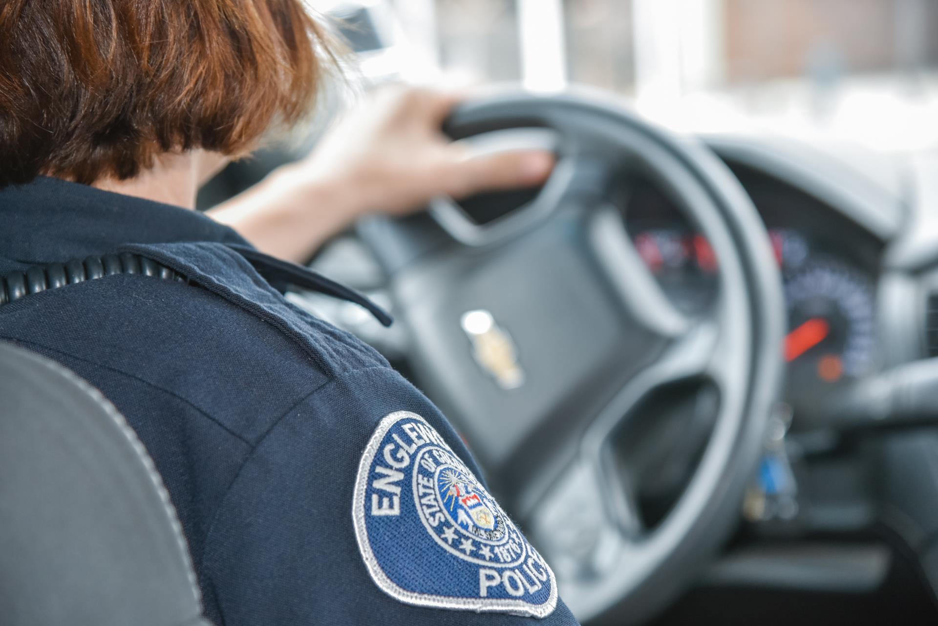 Police Officer Driving a Car