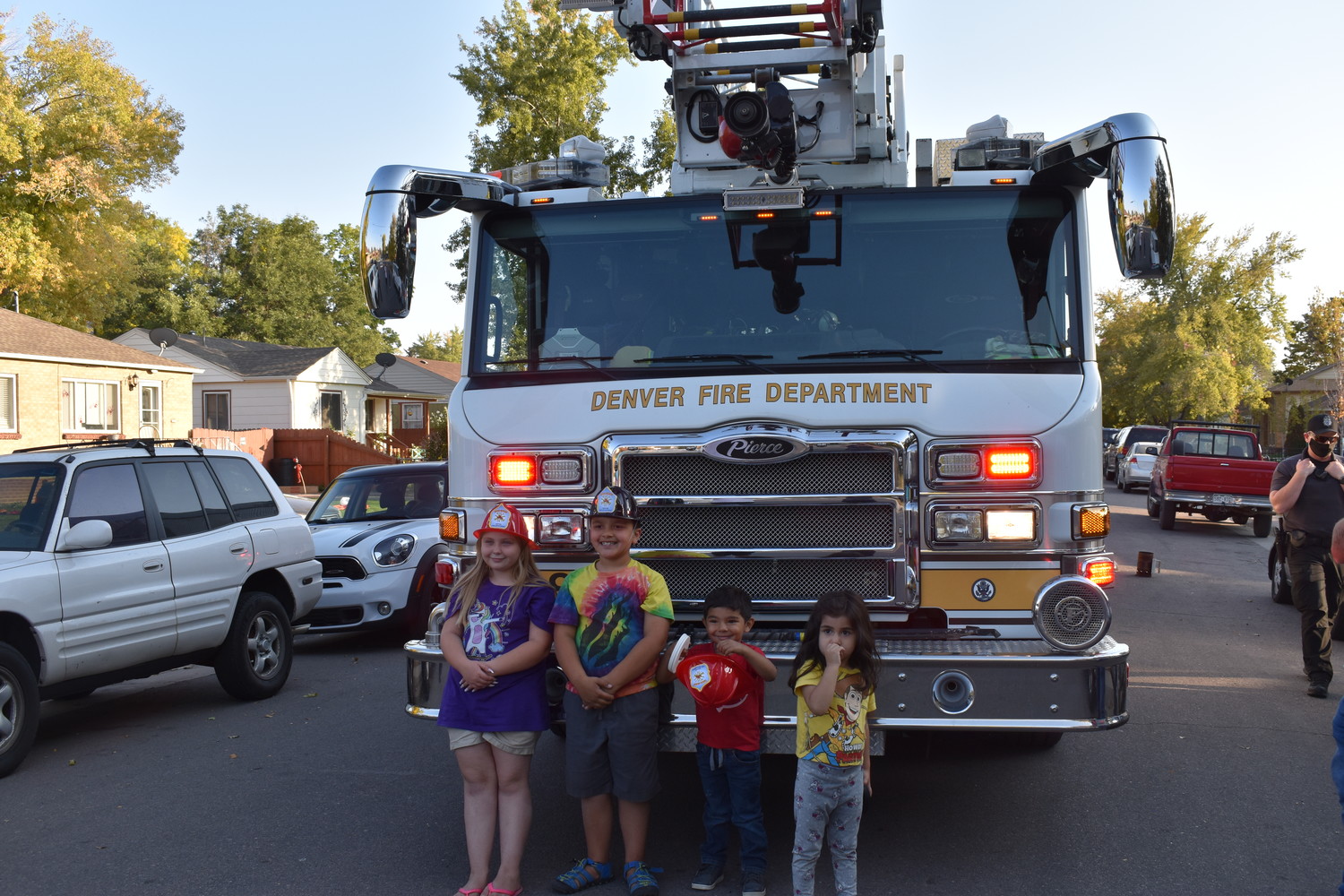 Kids in front of a fire truck