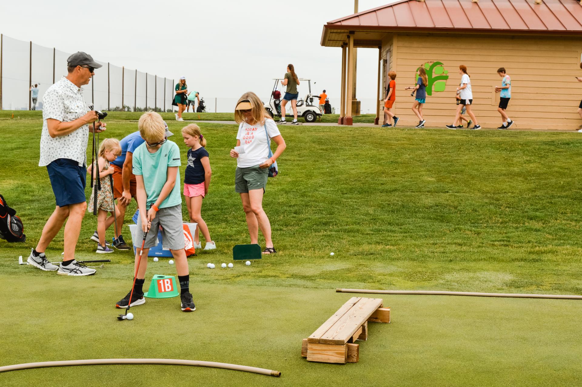 Child playing Putt Putt at Celebrate Golf Day